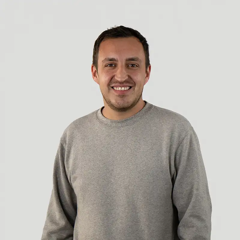 Your contact person is Marcel Küsel. A man in his 30s smiles warmly at the camera.